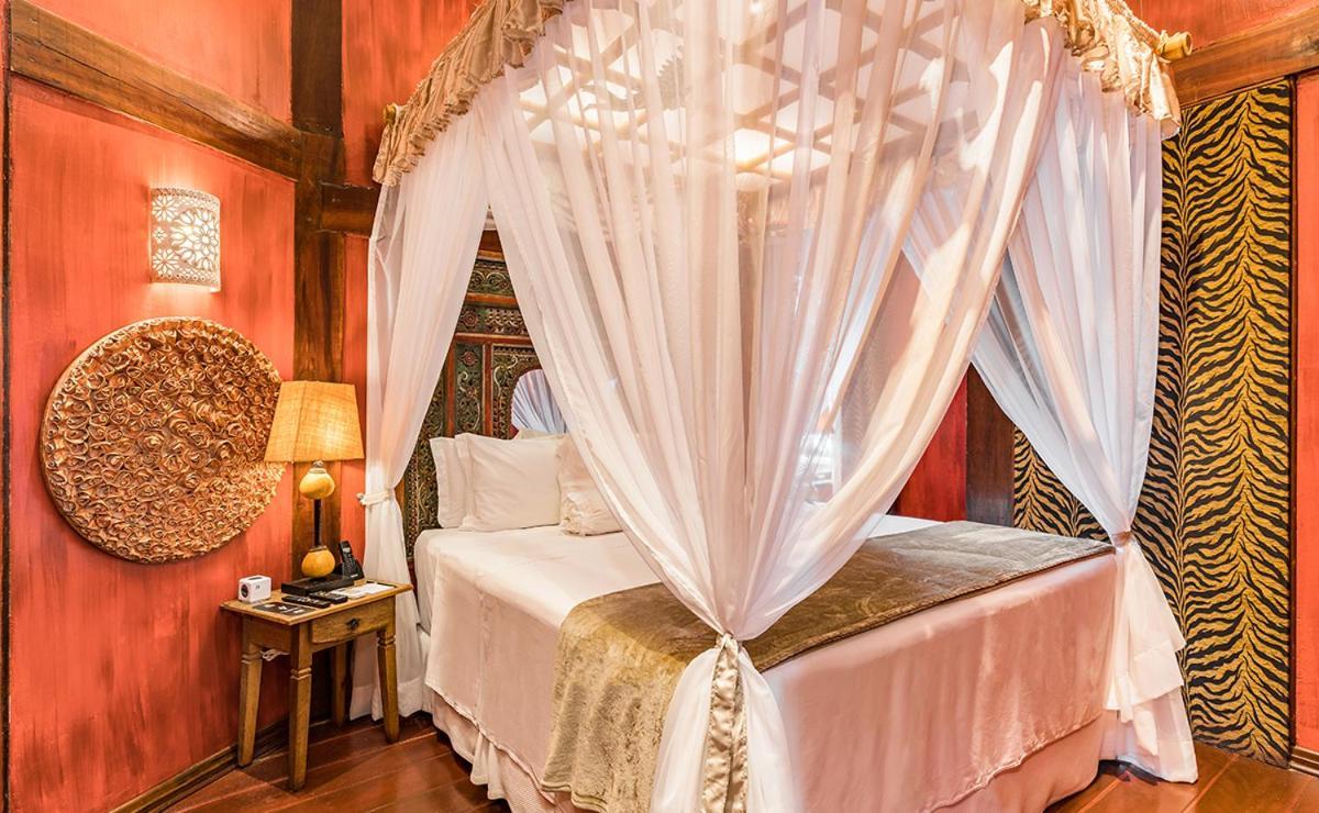 Dpny Beach Hotel & Spa Ilhabela Exterior photo A mosquito net over a bed